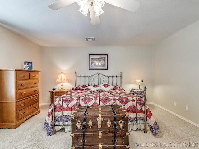 bedroom featuring light carpet, ceiling fan, visible vents, and baseboards