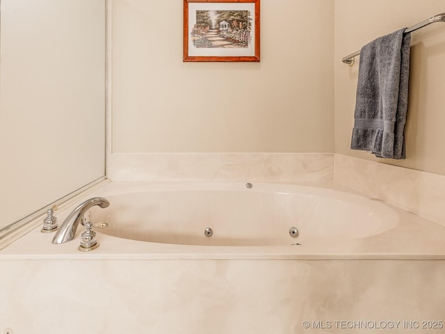 full bathroom with a whirlpool tub