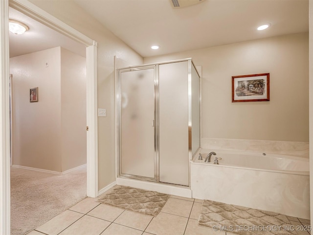 bathroom with recessed lighting, a shower stall, a bath, and tile patterned floors