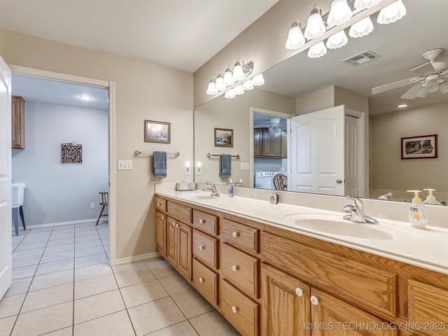 full bathroom with ceiling fan, tile patterned flooring, a sink, and visible vents