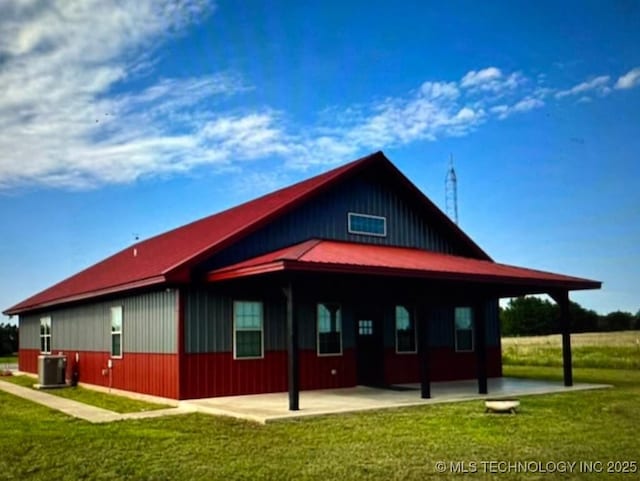 view of home's exterior featuring a yard, central AC unit, and a patio