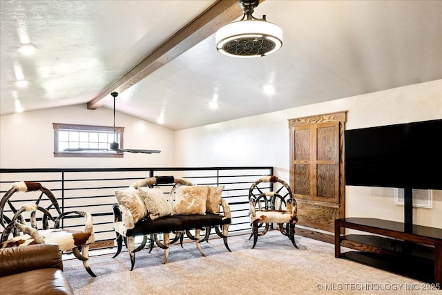 sitting room featuring a ceiling fan, carpet flooring, and lofted ceiling with beams