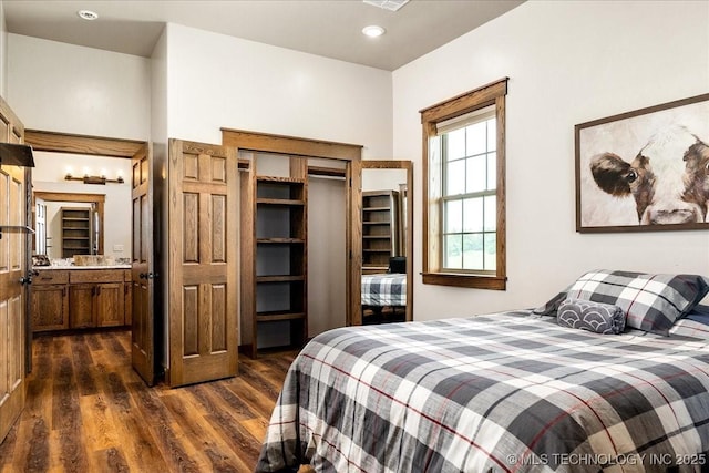 bedroom featuring dark wood-style floors