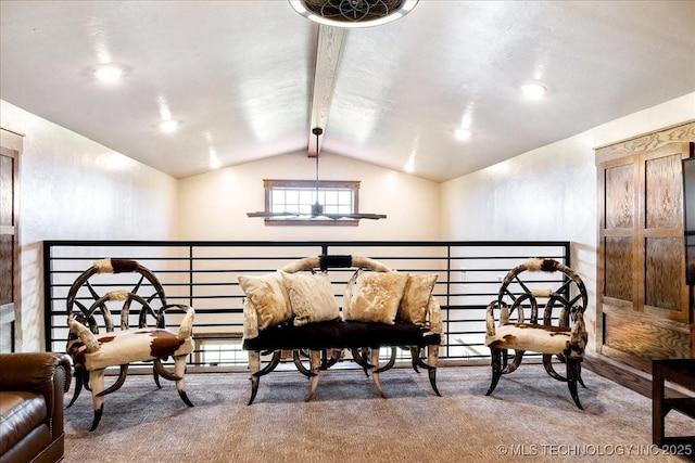 sitting room featuring carpet floors and vaulted ceiling with beams