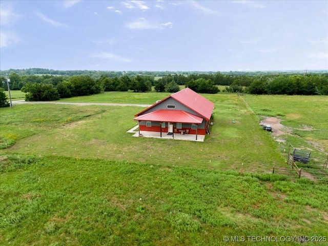 birds eye view of property with a rural view