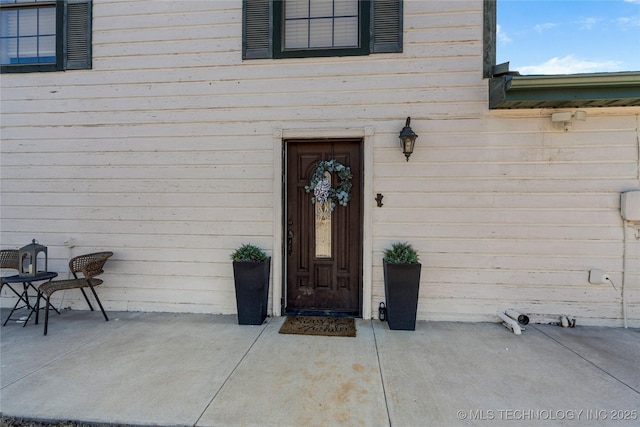 doorway to property featuring a patio area