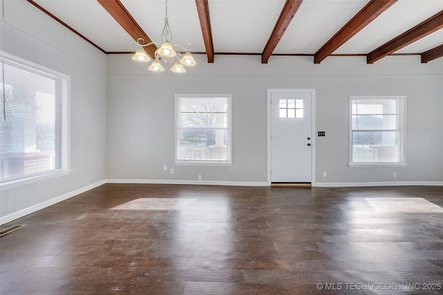 foyer featuring dark wood finished floors, visible vents, an inviting chandelier, beamed ceiling, and baseboards