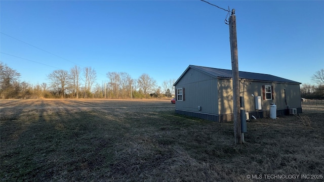 view of property exterior featuring metal roof