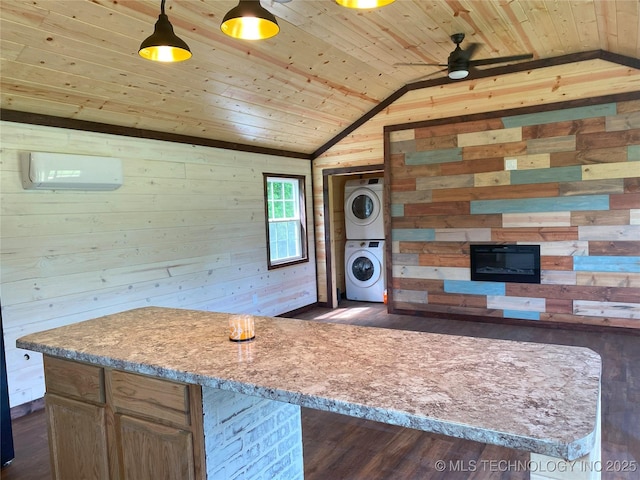 kitchen with a wall unit AC, wooden ceiling, lofted ceiling, and stacked washer and clothes dryer