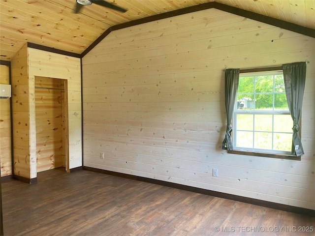 interior space with wooden ceiling, dark wood-style floors, vaulted ceiling, and wood walls