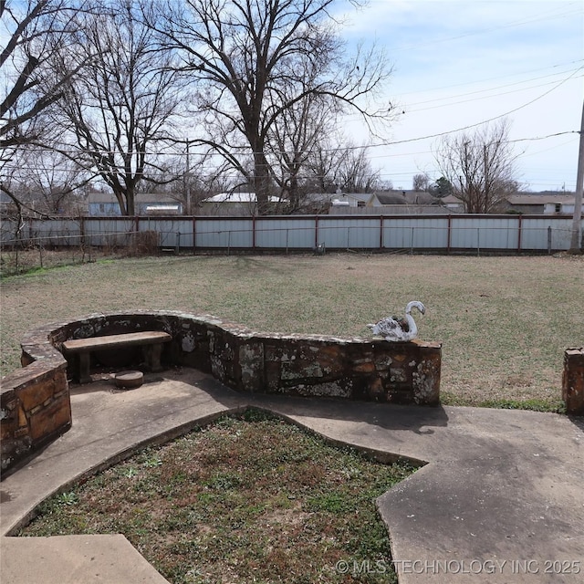 view of yard with a patio area and a fenced backyard