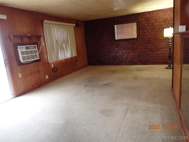 carpeted empty room with a wall mounted air conditioner