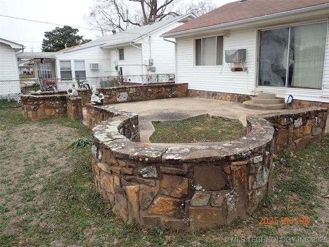 view of yard featuring entry steps and a patio area