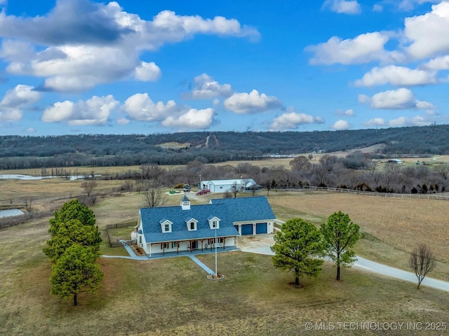 birds eye view of property featuring a rural view