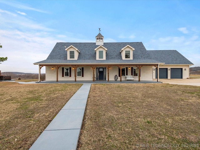 view of front of home with a porch, a front lawn, a shingled roof, and an attached garage