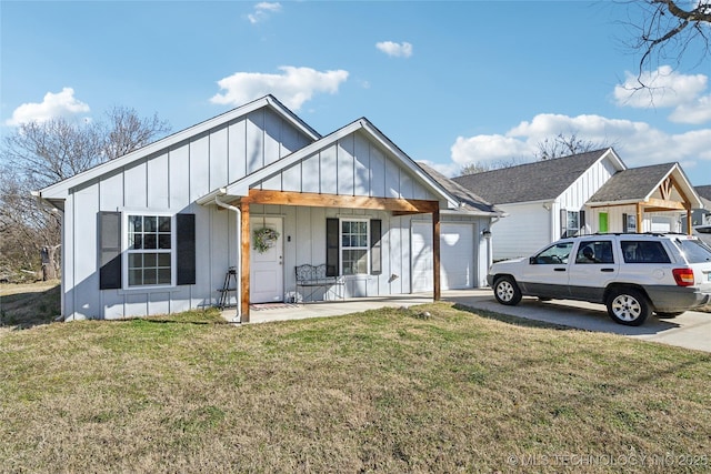 view of front of home featuring driveway, a porch, board and batten siding, and a front yard