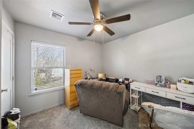 home office with carpet floors, baseboards, visible vents, and ceiling fan