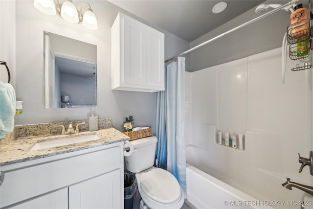 full bath with vanity, toilet, and shower / bath combo with shower curtain