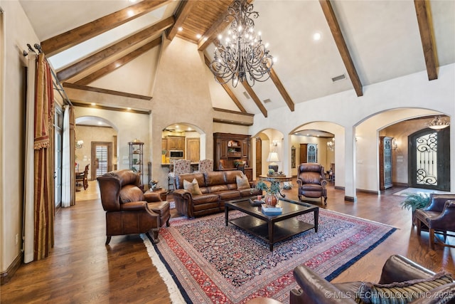 living room with arched walkways, high vaulted ceiling, wood finished floors, visible vents, and beamed ceiling