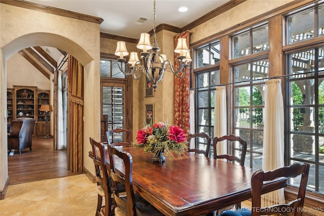 dining room with arched walkways, ornamental molding, visible vents, and a healthy amount of sunlight