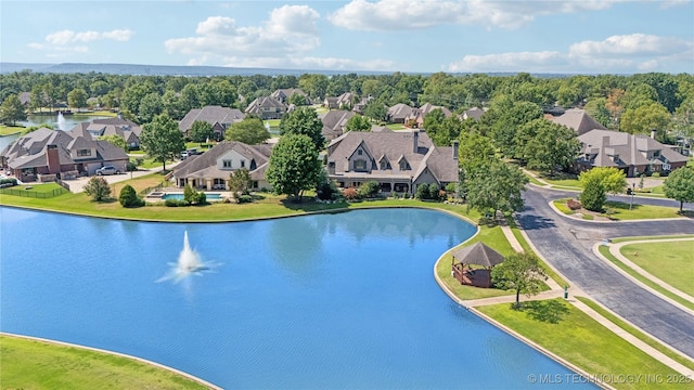 birds eye view of property featuring a water view and a residential view