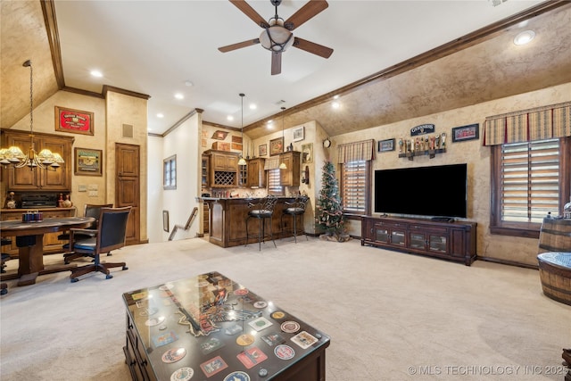 living area with crown molding, recessed lighting, light colored carpet, vaulted ceiling, and a bar