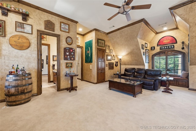 living room featuring carpet floors, visible vents, baseboards, a ceiling fan, and ornamental molding