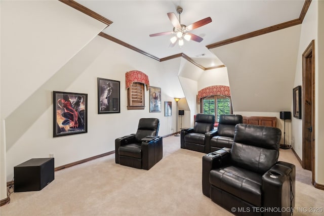 home theater featuring light carpet, a ceiling fan, visible vents, baseboards, and ornamental molding