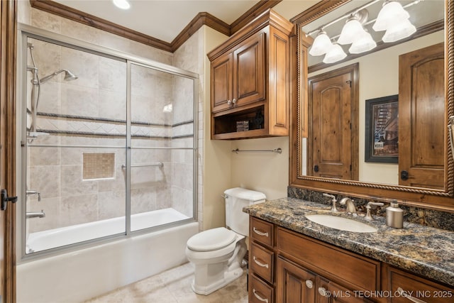 full bathroom with ornamental molding, combined bath / shower with glass door, vanity, and toilet