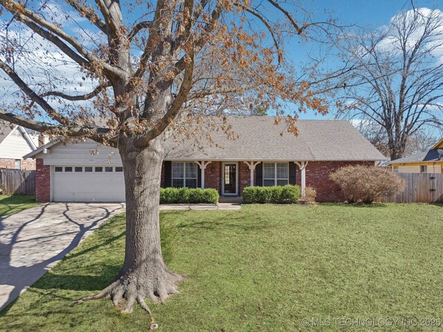 single story home with brick siding, concrete driveway, a front yard, and fence