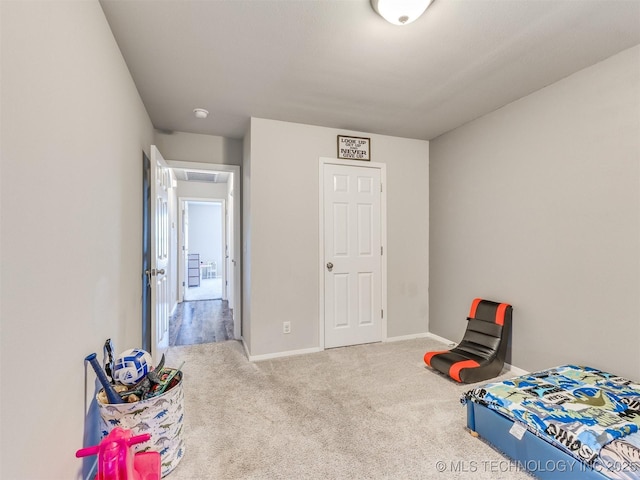 bedroom featuring carpet flooring and baseboards