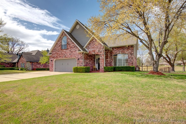 traditional-style home featuring brick siding, concrete driveway, an attached garage, fence, and a front lawn