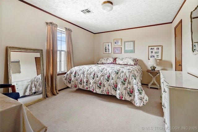 carpeted bedroom with ornamental molding, visible vents, and a textured ceiling