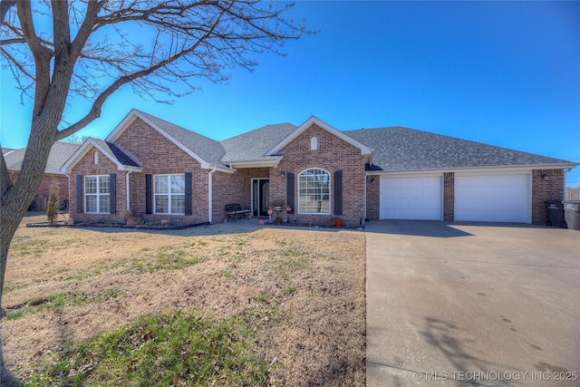 ranch-style house featuring driveway, brick siding, a front lawn, and an attached garage