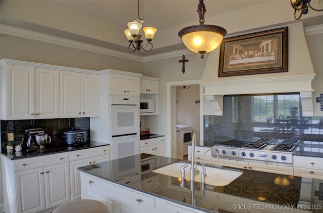 kitchen with white cabinetry, white appliances, ornamental molding, and a sink