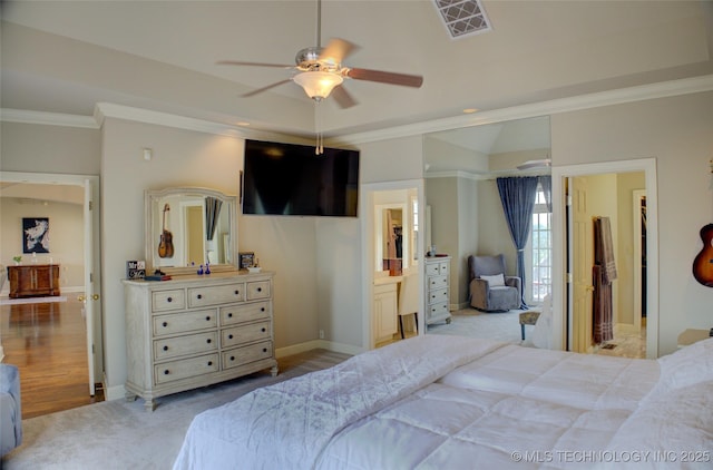 bedroom featuring a ceiling fan, carpet, visible vents, baseboards, and crown molding