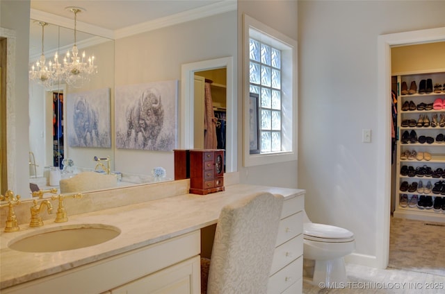 full bathroom featuring vanity, crown molding, a walk in closet, and toilet