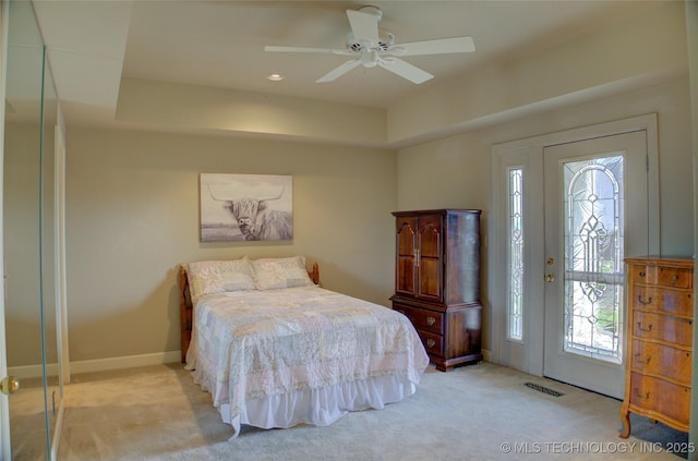 bedroom featuring multiple windows, visible vents, baseboards, and carpet floors