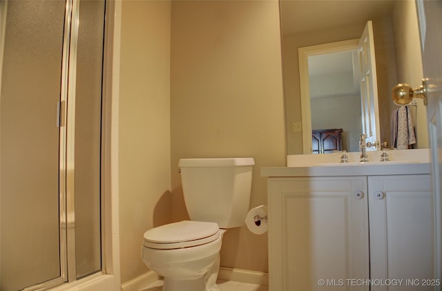 full bath with a stall shower, toilet, vanity, and baseboards