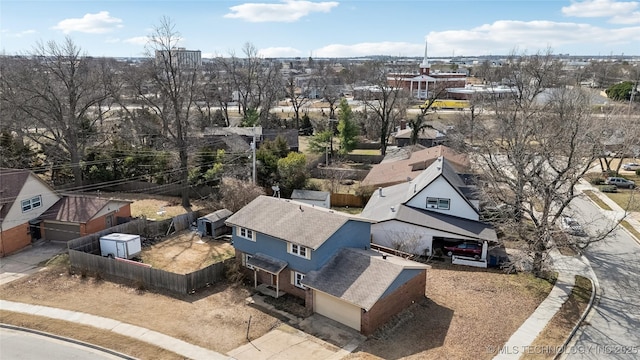 birds eye view of property with a residential view