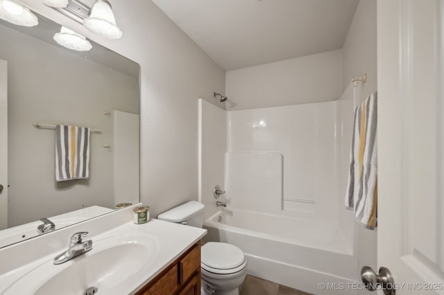 full bathroom featuring bathtub / shower combination, vanity, and toilet