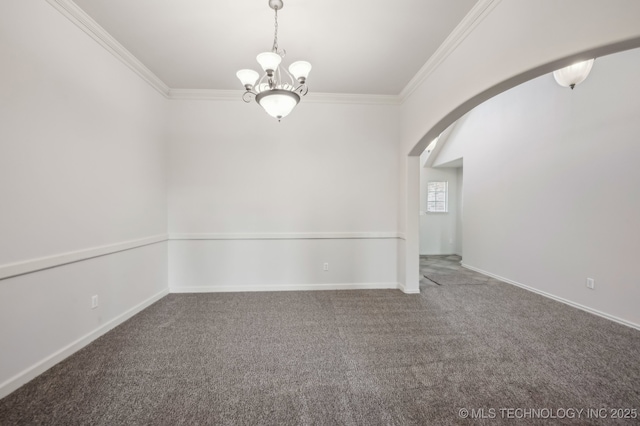 carpeted empty room with ornamental molding, arched walkways, a chandelier, and baseboards