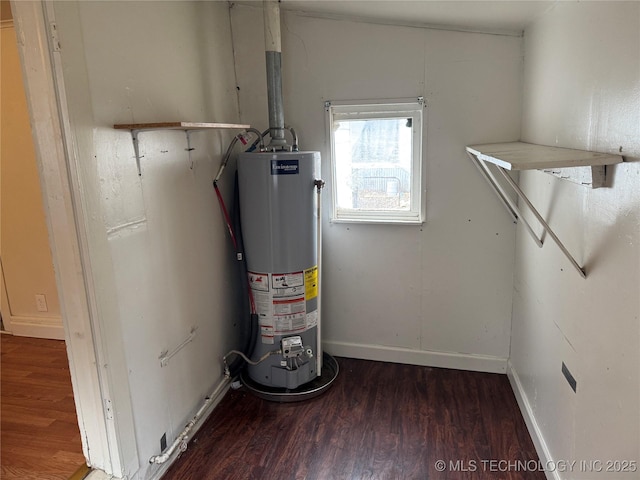 utility room featuring water heater