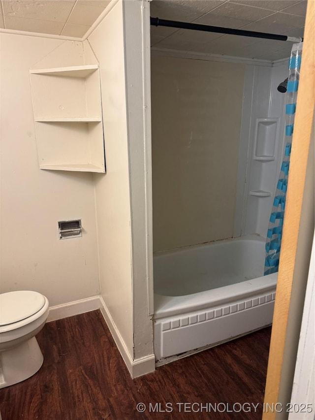 full bathroom featuring a baseboard heating unit, wood finished floors, toilet, and baseboards