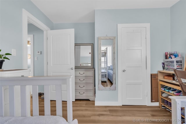 bedroom with wood finished floors