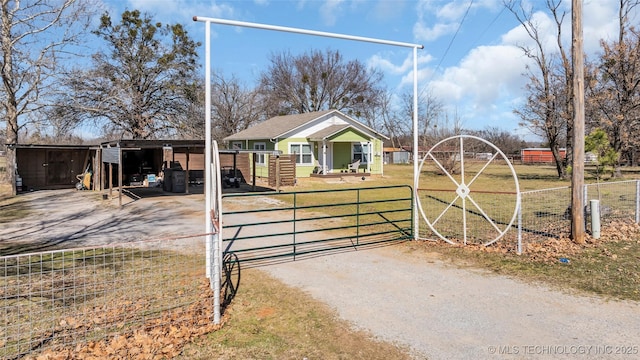 exterior space featuring a gate, driveway, and a gated entry