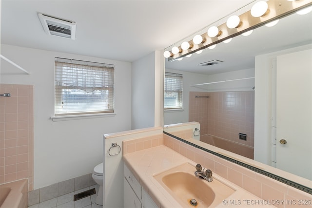 bathroom with toilet, visible vents, and shower / washtub combination