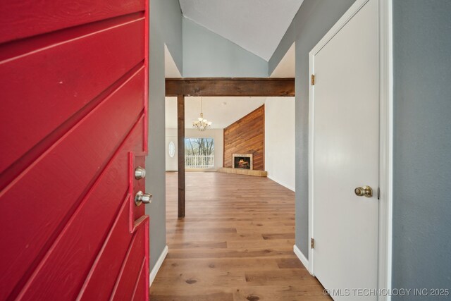 9435 S 33rd W Ave, Tulsa, OK 74132 - foyer entrance featuring lofted ceiling, light wood-type flooring, a chandelier, and baseboards