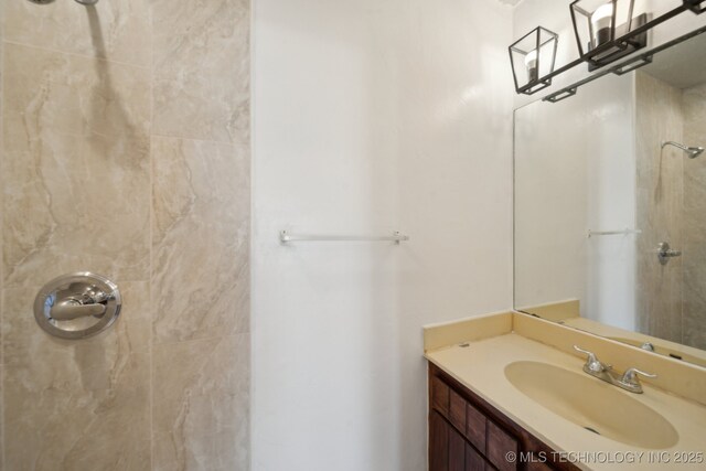 9435 S 33rd W Ave, Tulsa, OK 74132 - bathroom featuring tiled shower and vanity