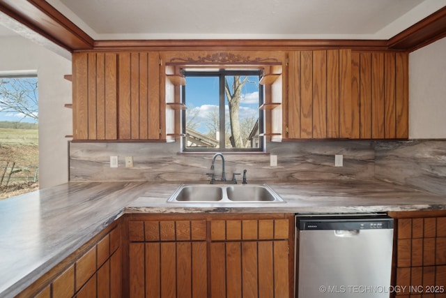 kitchen featuring a sink, light countertops, dishwasher, tasteful backsplash, and brown cabinetry